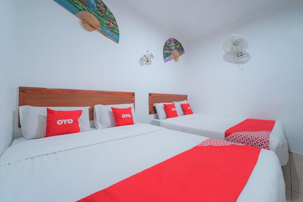 Oyo 89850 Mutiara Motel Куа Екстериор снимка